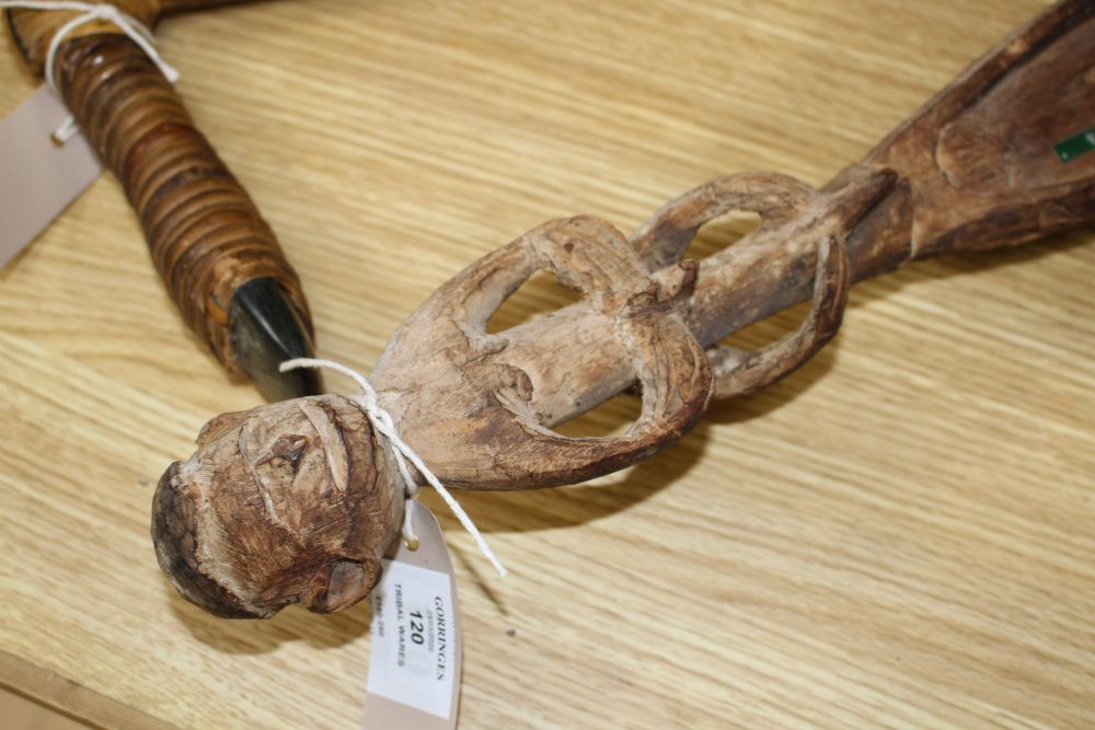 An Asmat Regency, Papua carved wood figural ceremonial sago bowl and various other tribal artifacts,